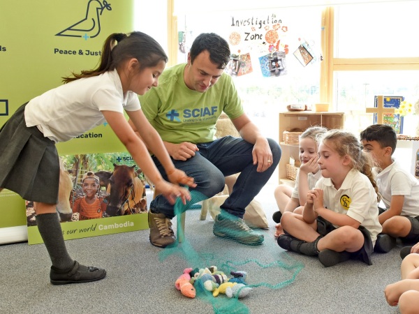 Primary school pupils with Mark Booker - cover