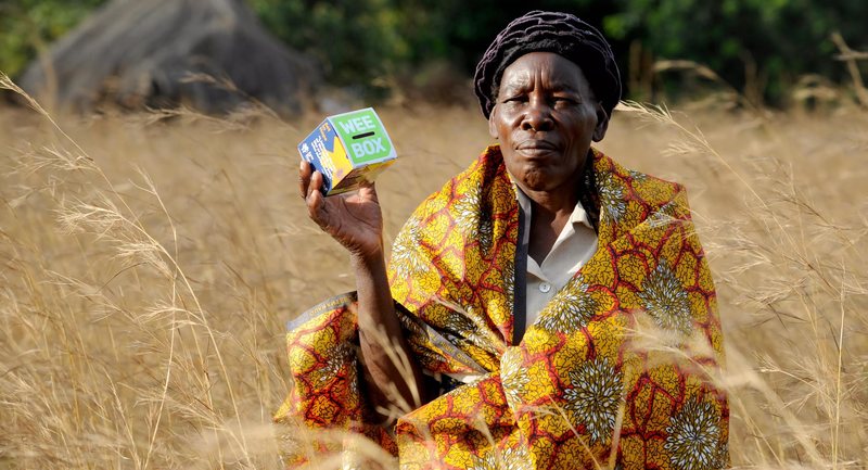 Catherine from Zambia holding a WEE BOX