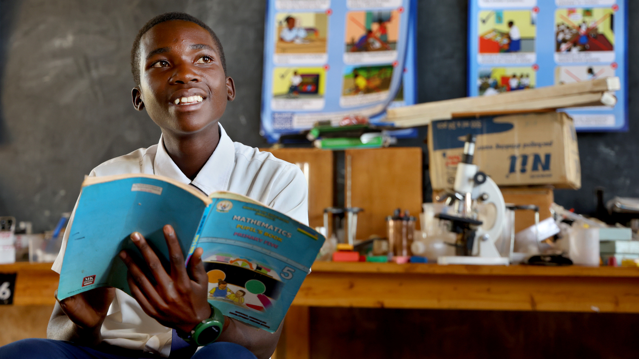 Jonathan in Rwanda attends school thanks to the work of SCIAF and our partners in the community. 
