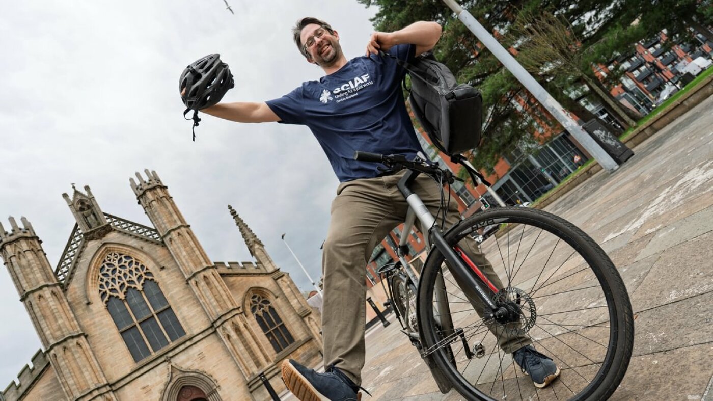 Mark on a bike, smiling